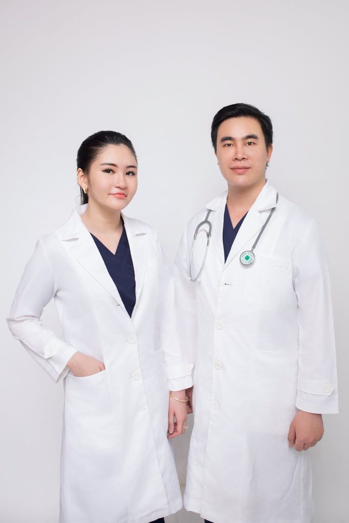 Man and Woman Doctors in Aprons 